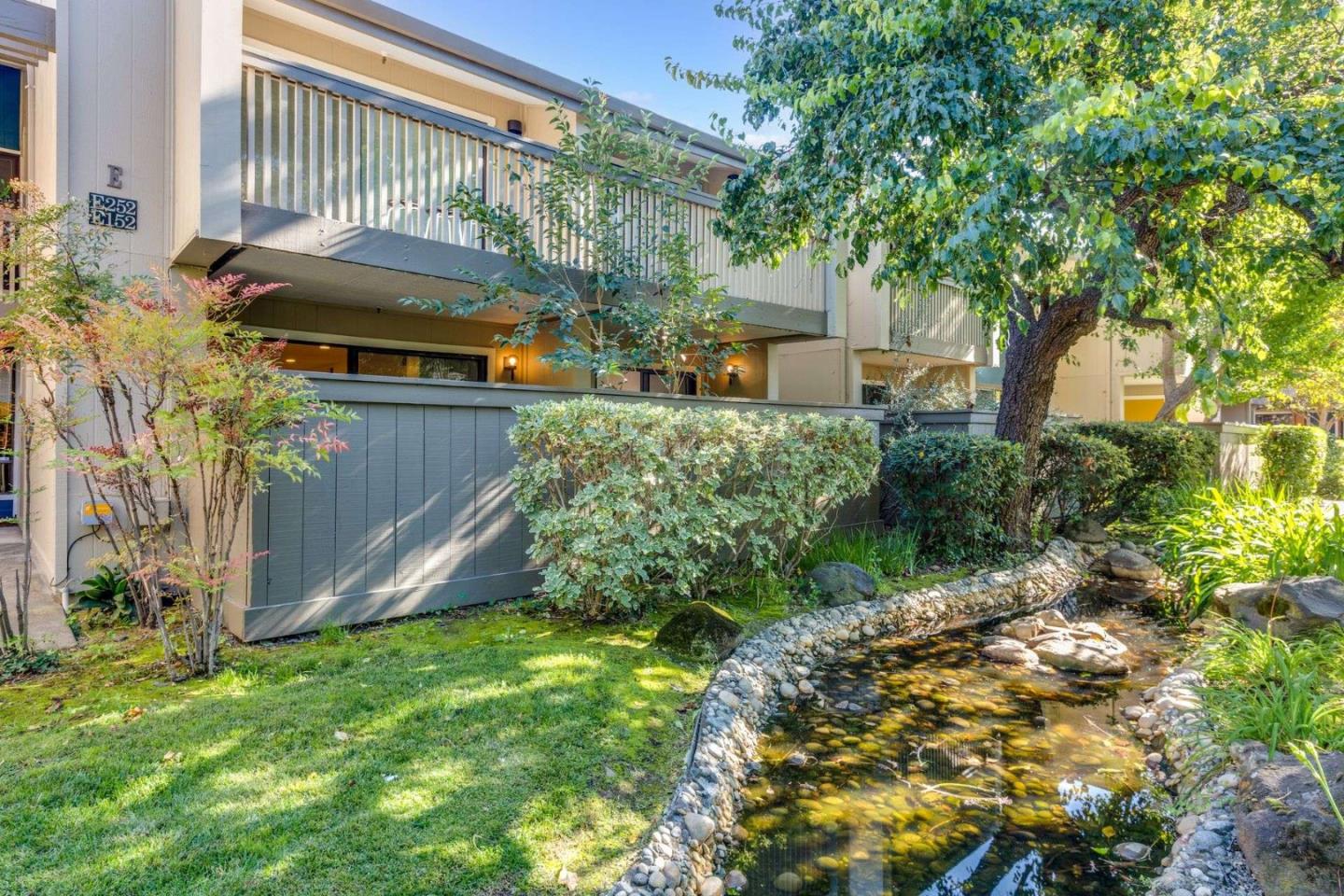 49 Showers Drive, Unit E152 Mountain View, CA 94040 - Photo 19 of 27 front view of a house with a yard