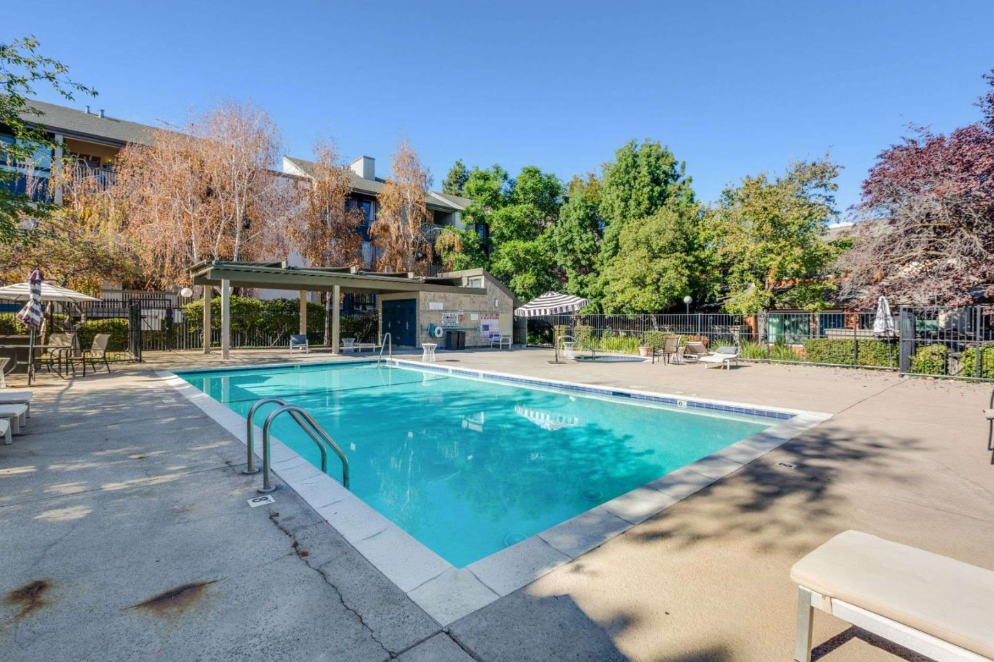 49 Showers Drive, Unit E152 Mountain View, CA 94040 - Photo 20 of 27 a view of a house with a swimming pool