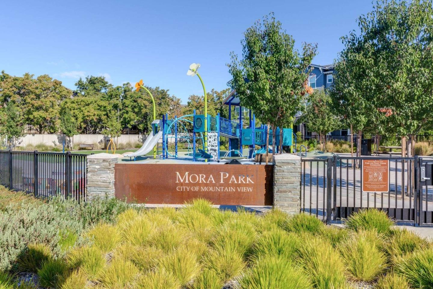 49 Showers Drive, Unit E152 Mountain View, CA 94040 - Photo 23 of 27 a view of residential house with sign board and yard