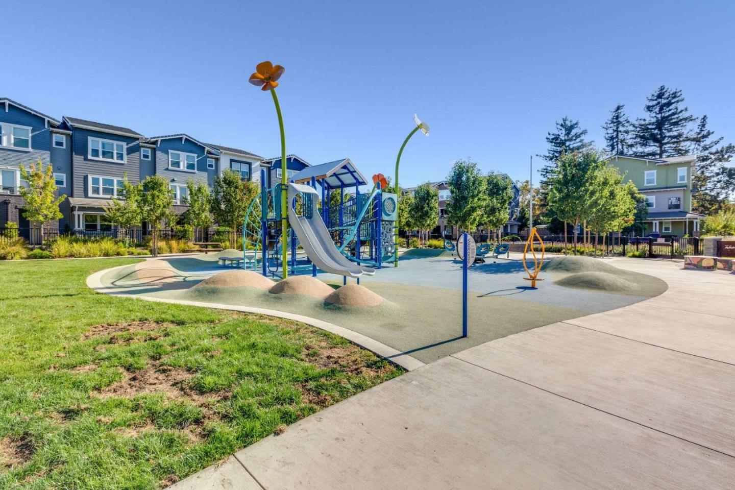 49 Showers Drive, Unit E152 Mountain View, CA 94040 - Photo 24 of 27 a view of a park with swings and slides