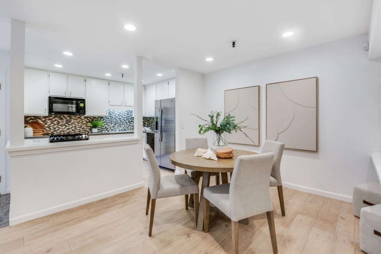 49 Showers Drive, Unit E152 Mountain View, CA 94040 - Photo 3 of 27 a kitchen with a table and chairs in it
