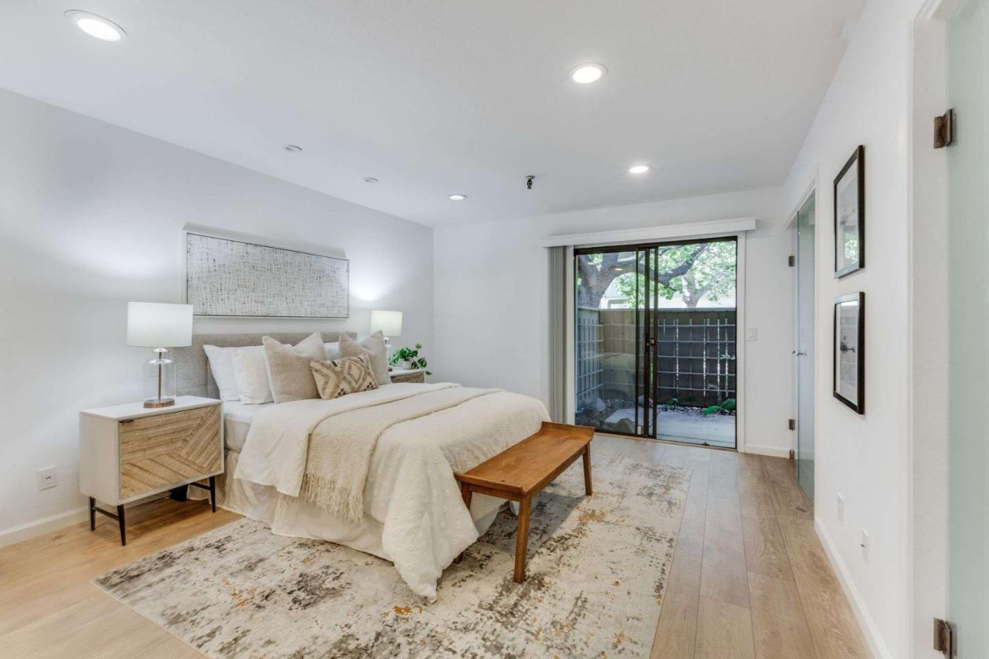 49 Showers Drive, Unit E152 Mountain View, CA 94040 - Photo 9 of 27 a bed room with a bed and a chair