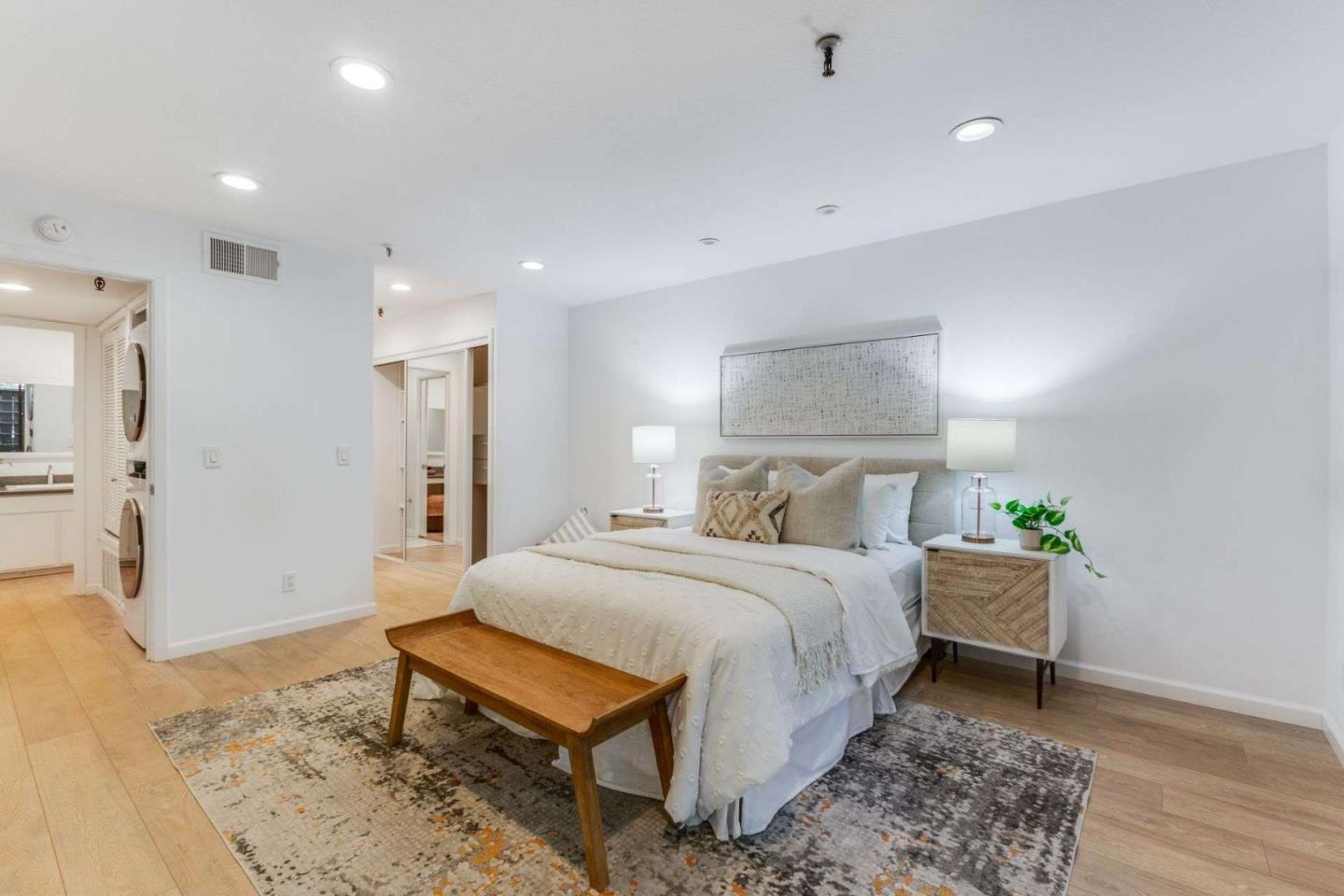 49 Showers Drive, Unit E152 Mountain View, CA 94040 - Photo 10 of 27 a bedroom with a bed and a table