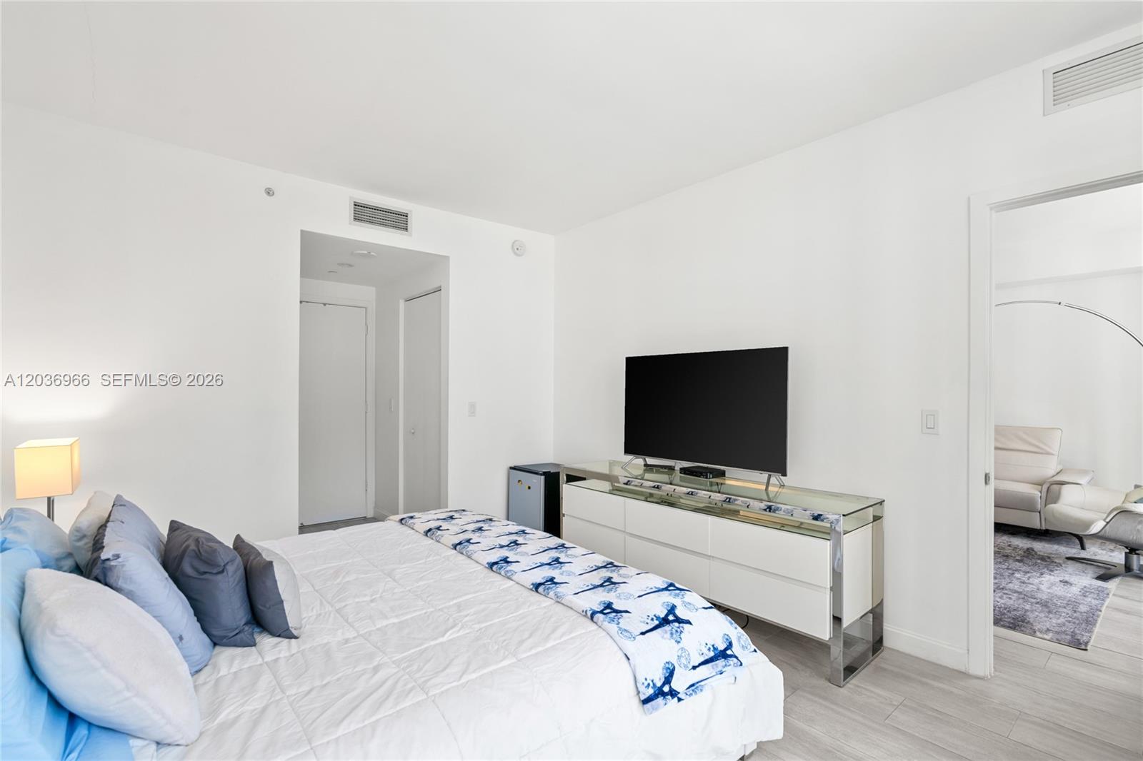 55 Southwest 9th Street, Unit 1904 Miami, FL 33130 - Photo 38 of 66 a bedroom with a bed and a flat screen tv