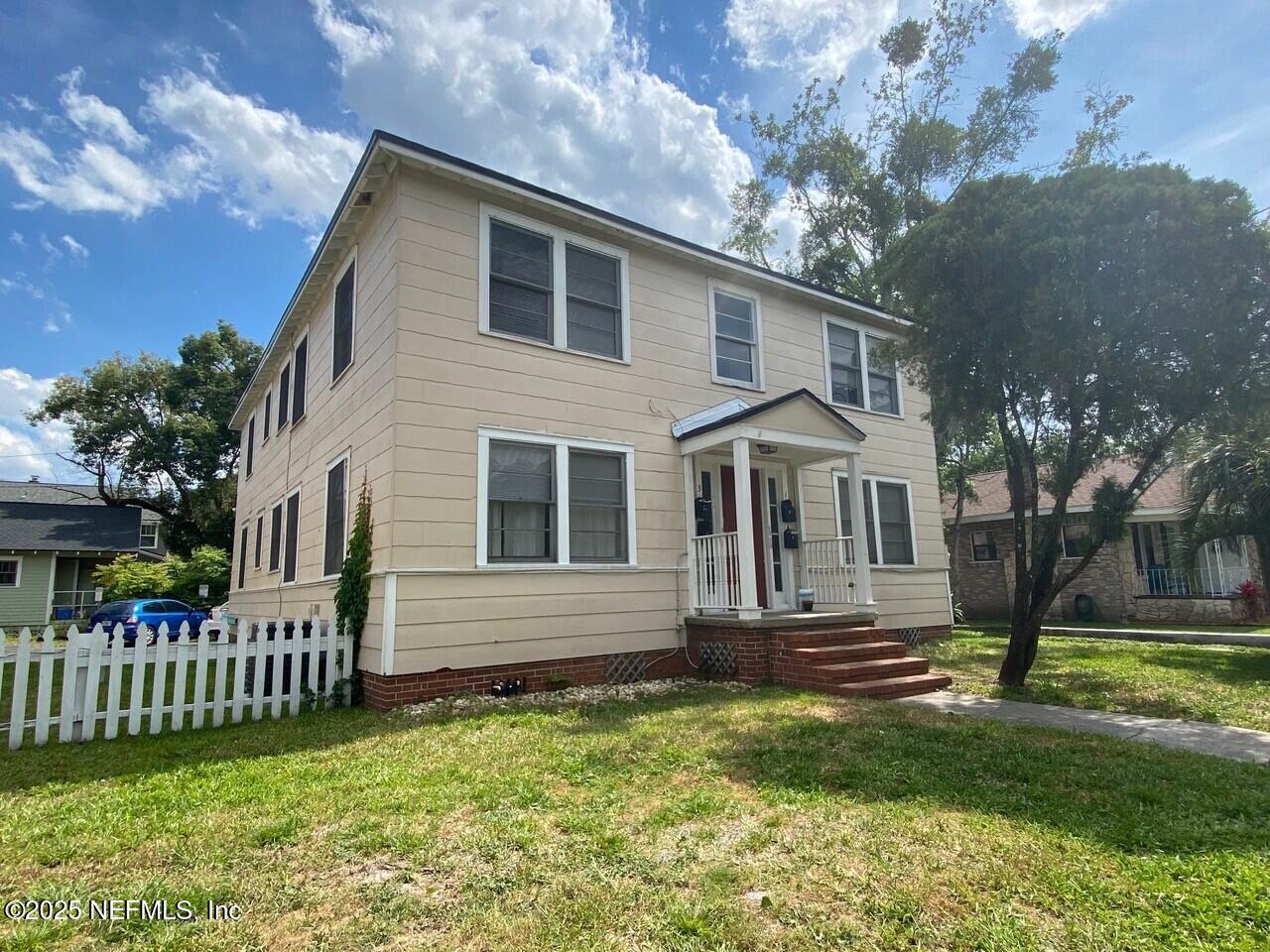 2614 College Street, Unit 1 Jacksonville, FL 32204 - Photo 2 of 17 a front view of a house with a yard