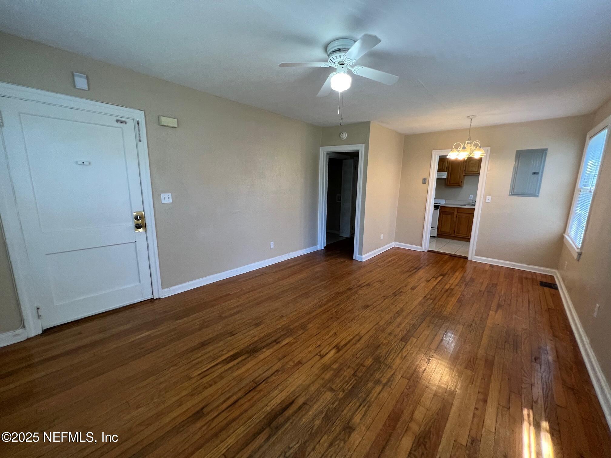 2614 College Street, Unit 1 Jacksonville, FL 32204 - Photo 6 of 17 wooden floor in an empty room with a window