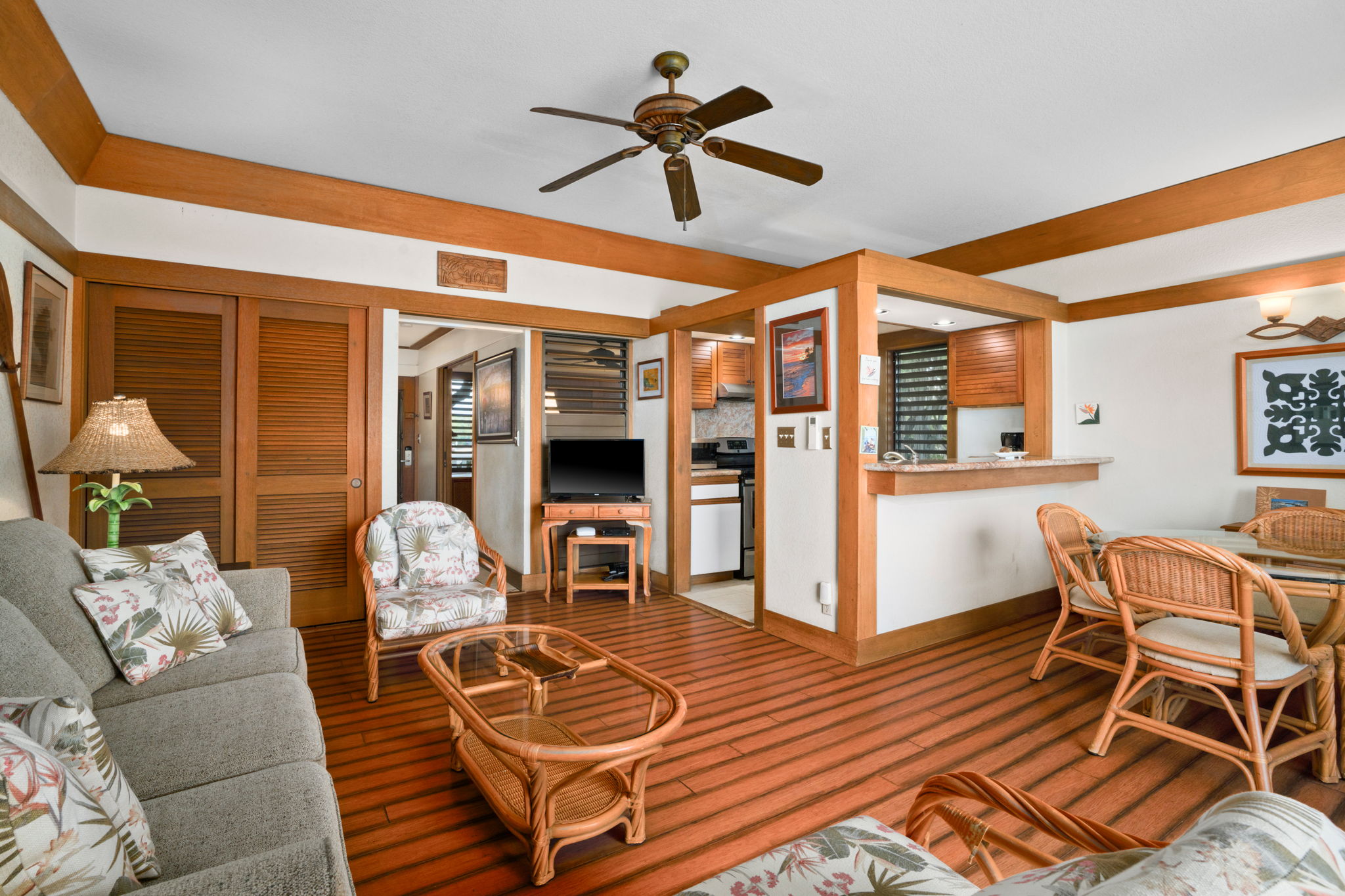2253 Poipu Road, Unit 330 Koloa, HI 96756 - Photo 9 of 26 a living room with furniture a rug and a chandelier