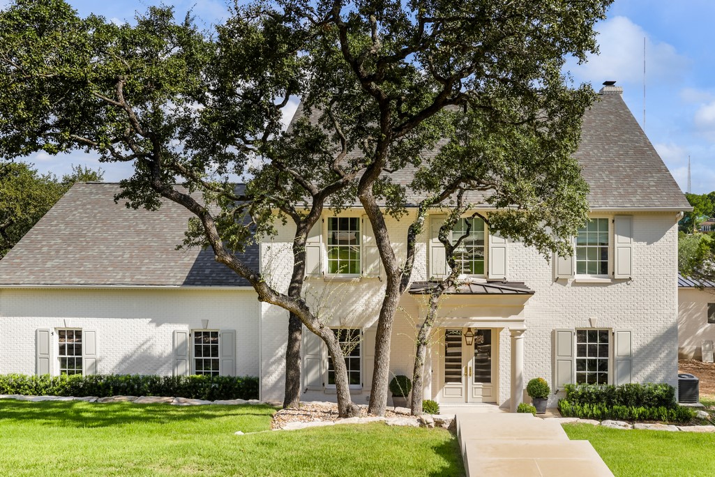5201 Fossil Rim Road Austin, TX 78746 - Photo 1 of 36 front view of house with a yard