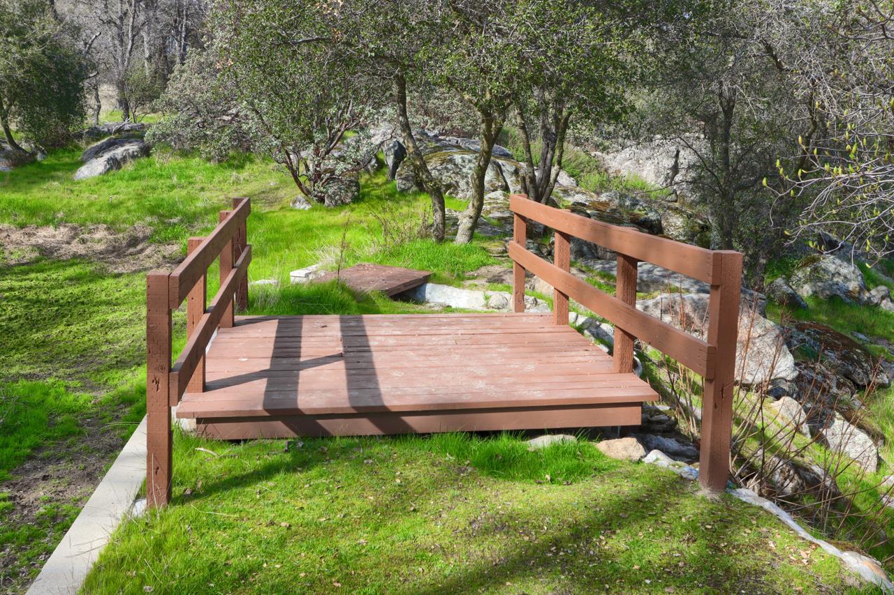 44755 Savage Road Coarsegold, CA 93614 - Photo 40 of 70 Bride across the cascading waterfall