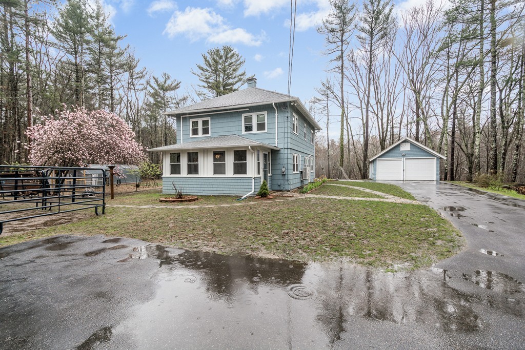 a view of a house with a yard covered with snow