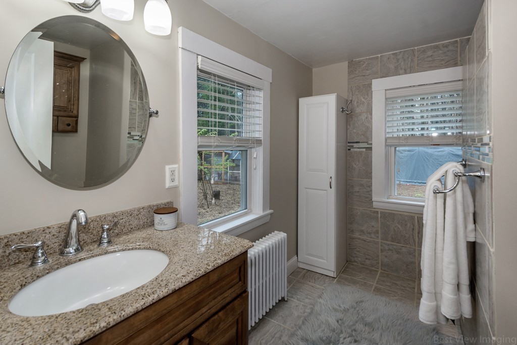 33 Burnham Road Bolton, MA 01740 - Photo 11 of 26 a en suite bathroom with a granite countertop double vanity sink and a mirror