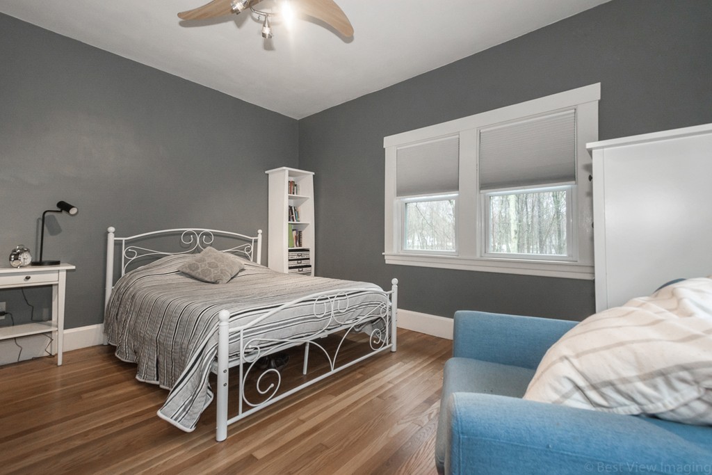 33 Burnham Road Bolton, MA 01740 - Photo 17 of 26 a bedroom with a bed and a window