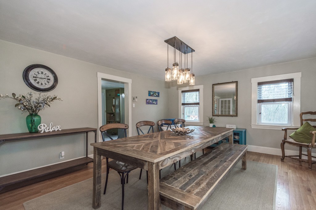 33 Burnham Road Bolton, MA 01740 - Photo 5 of 26 a view of a dining room with furniture window and wooden floor