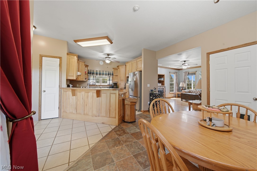 12159 Lawndell Road Southwest Beach City, OH 44608 - Photo 12 of 49 Kitchen featuring wood-finish cabinetry, stainless steel refrigerator, and recessed lighting