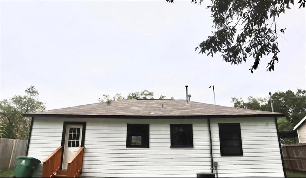 5122 Higgins Street Houston, TX 77033 - Photo 8 of 9 a view of a house with a backyard