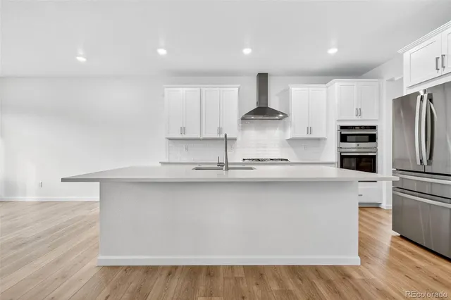 a spacious bathroom with a shower sink and mirror