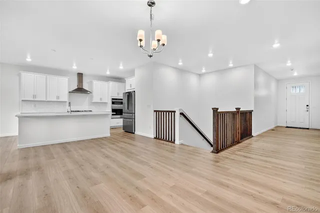 a view of a kitchen with a sink and cabinets