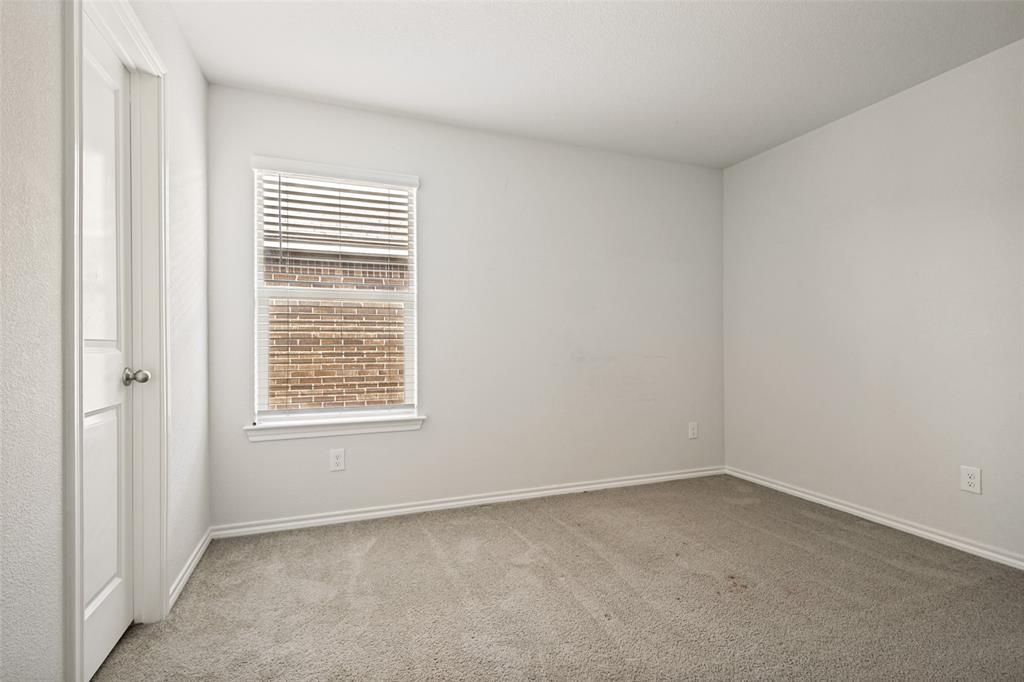 621 Spaulding Street Justin, TX 76247 - Photo 13 of 22 an empty room with a window
