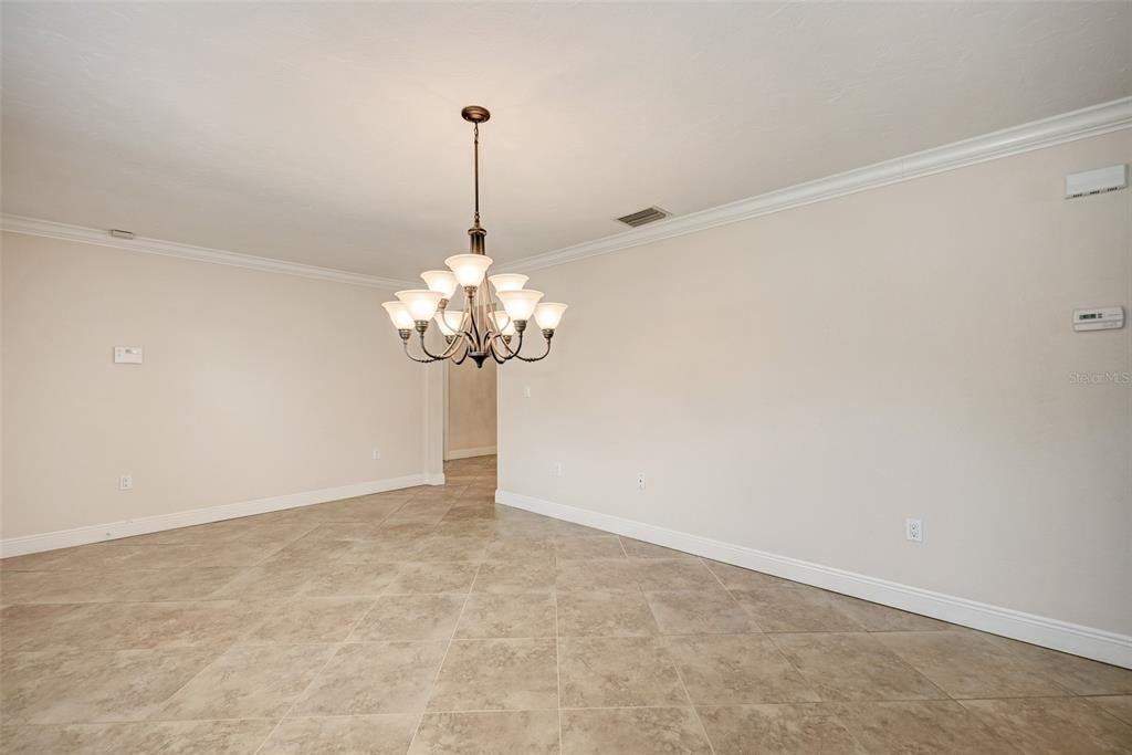1330 Georgetowne Circle Sarasota, FL 34232 - Photo 8 of 46 a view of a chandelier in a room