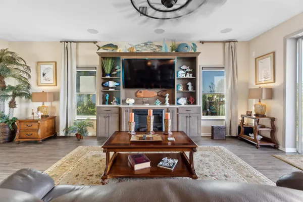 a large bed sitting in a bedroom next to a window