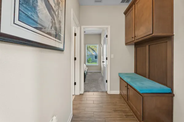 a bathroom with mirror sink and a mirror