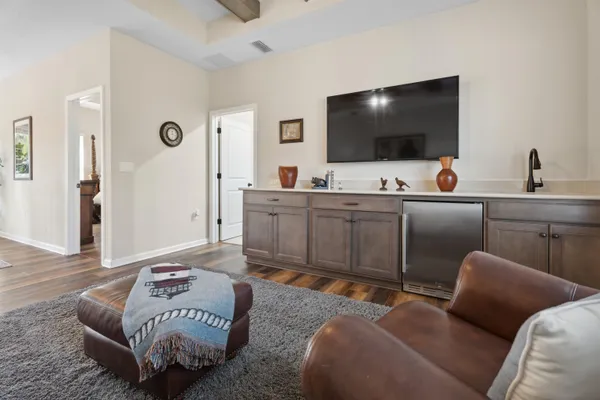a aerial view of a house with a yard and ocean view