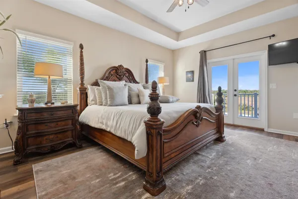an aerial view of a house with a yard and outdoor seating