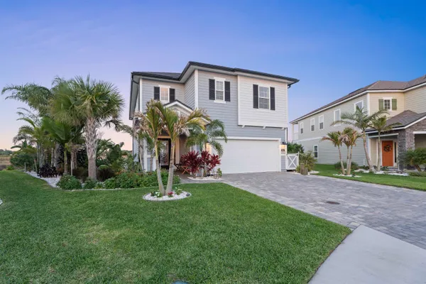 a view of a chairs and table in the patio