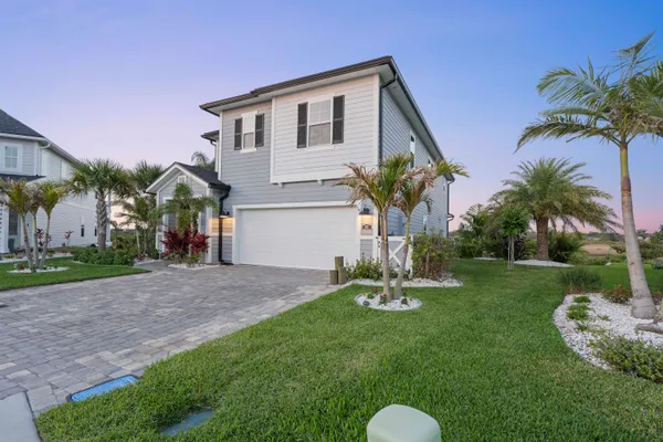 a view of a chairs and table in the patio