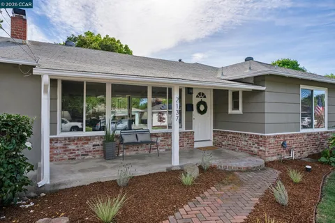 a view of house with outdoor seating space
