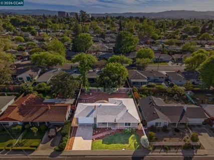 an aerial view of a house with a yard