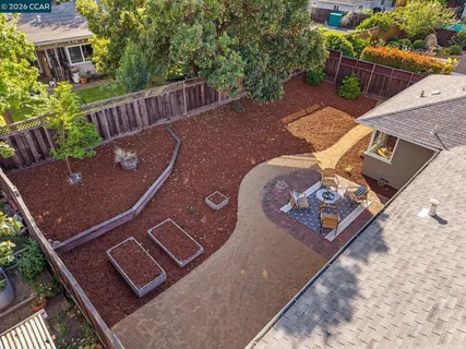 an aerial view of house with yard