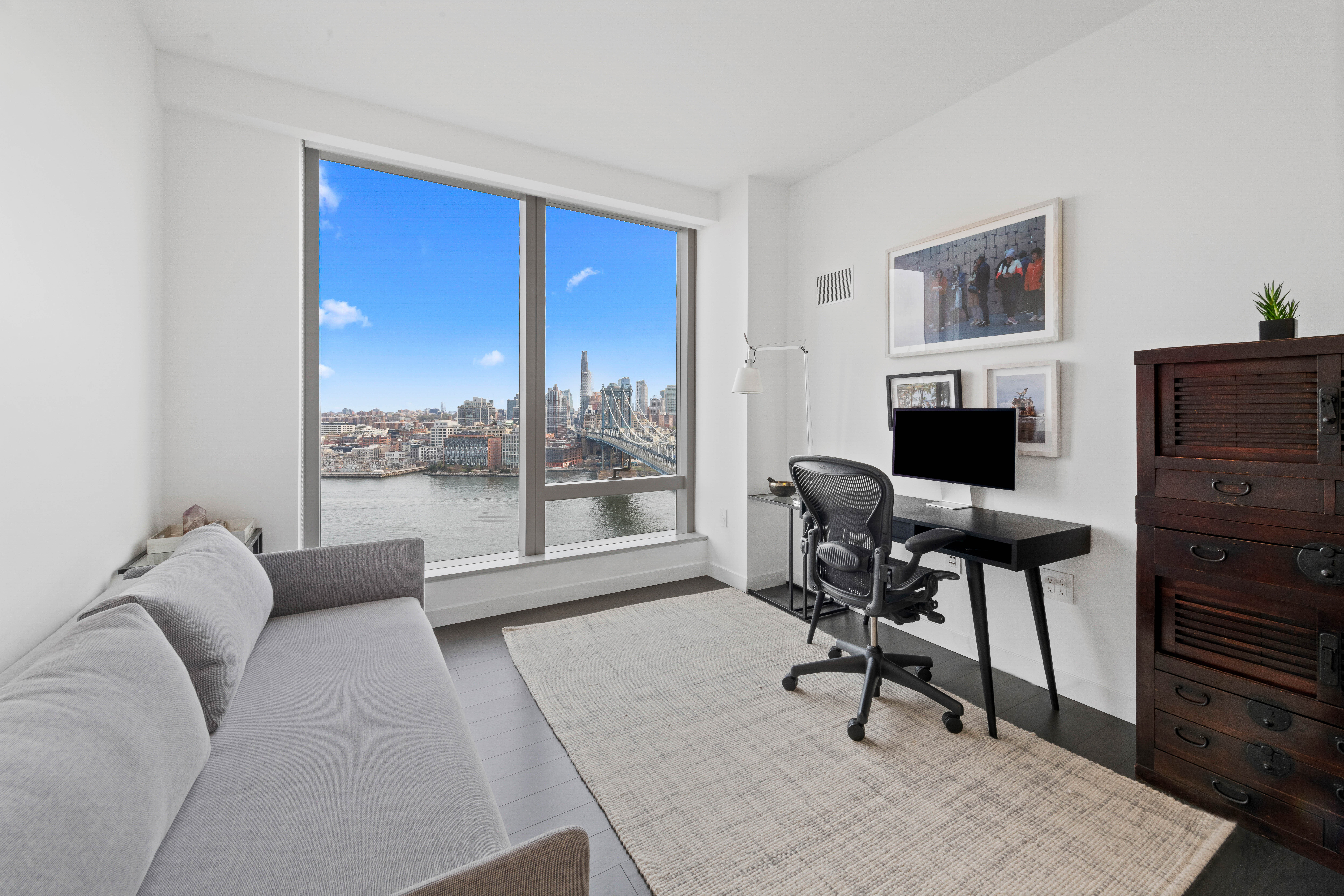 252 South Street, Unit 25D Manhattan, NY 10002 - Photo 12 of 36 a view of a livingroom with workspace and a couch
