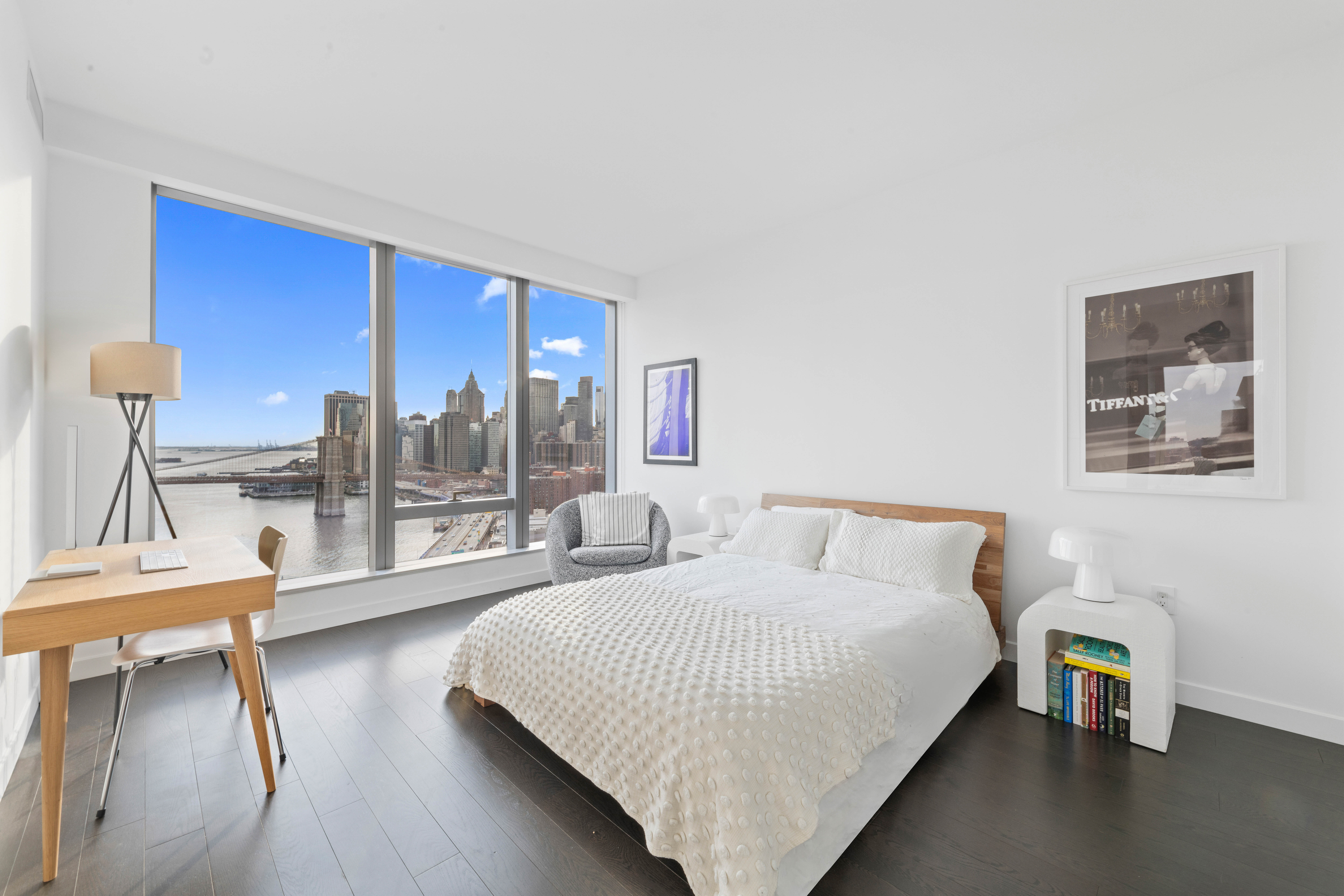 252 South Street, Unit 25D Manhattan, NY 10002 - Photo 9 of 36 a bedroom with a bed and a chair