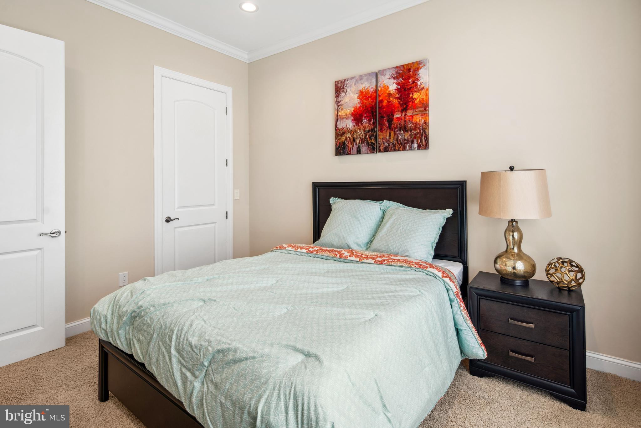 2 Samjan Circle Hightstown, NJ 08520 - Photo 25 of 36 a bedroom with a bed and a painting on the wall