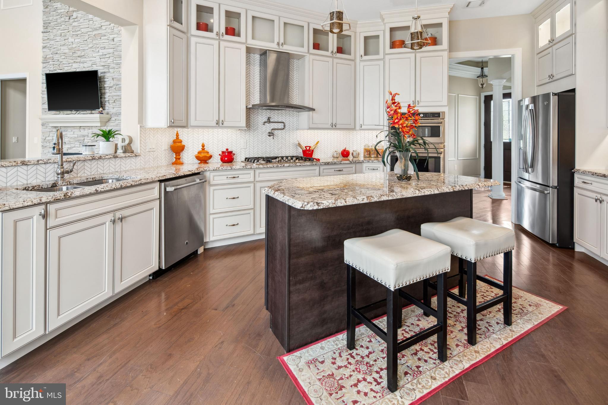 2 Samjan Circle Hightstown, NJ 08520 - Photo 3 of 36 a kitchen with stainless steel appliances granite countertop a table chairs sink and cabinets