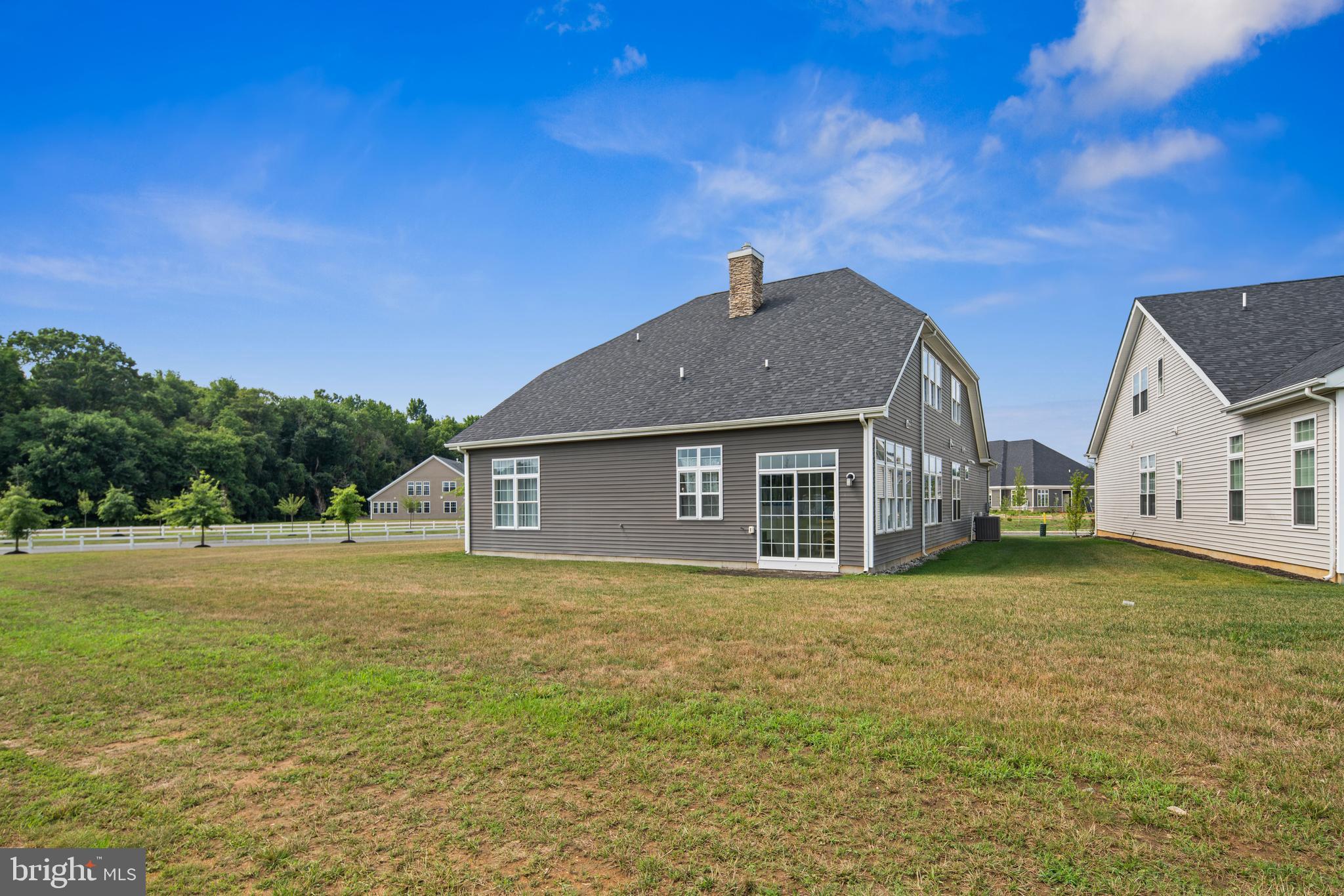 2 Samjan Circle Hightstown, NJ 08520 - Photo 36 of 36 a front view of house with yard and trees in the background