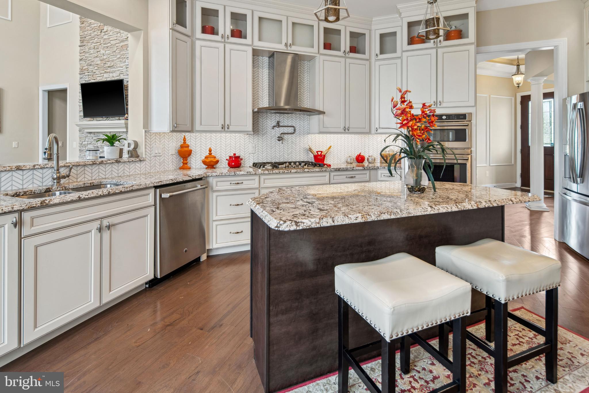 2 Samjan Circle Hightstown, NJ 08520 - Photo 5 of 36 a kitchen with stainless steel appliances granite countertop a sink cabinets and wooden floor