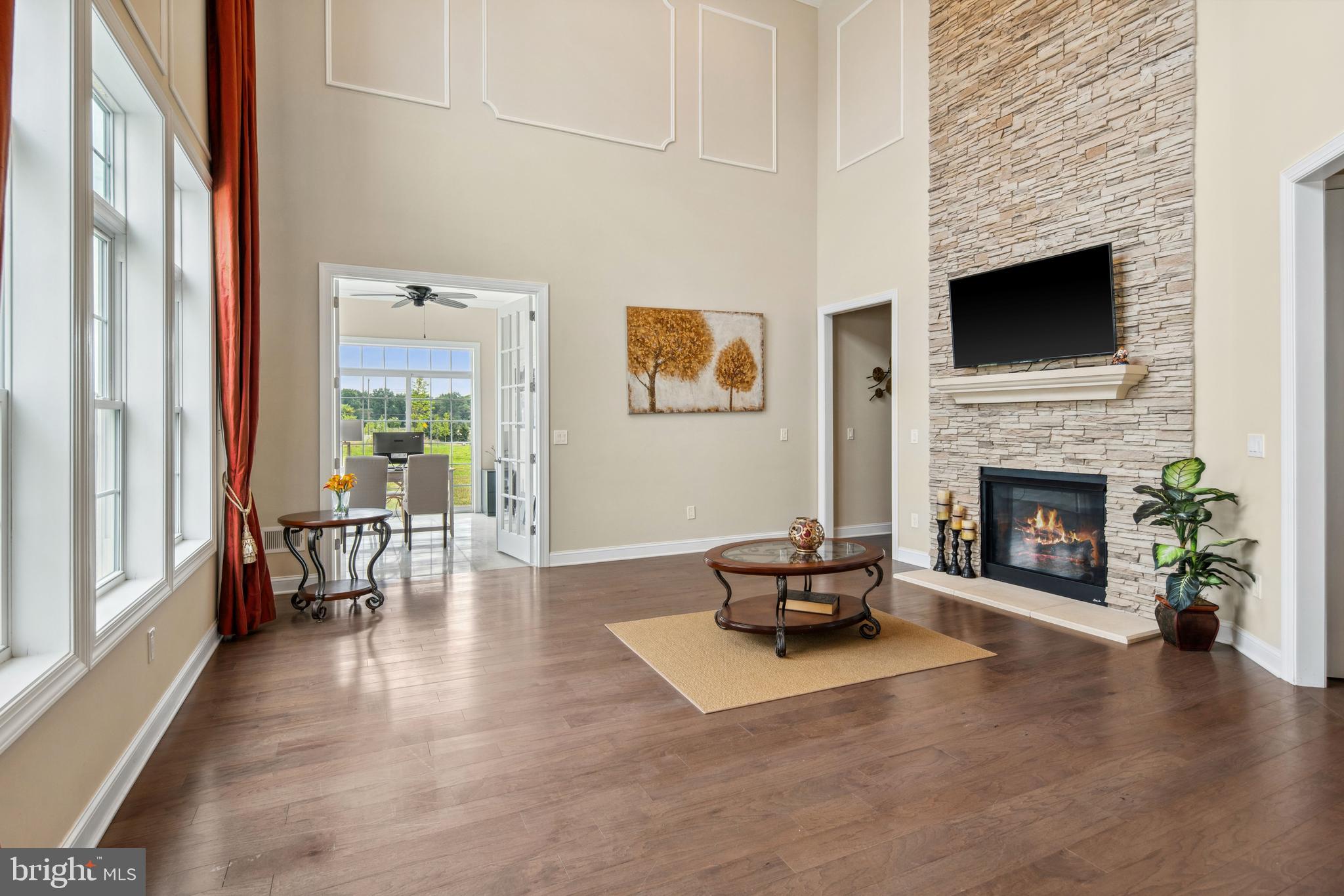 2 Samjan Circle Hightstown, NJ 08520 - Photo 10 of 36 a living room with furniture wooden floor and a fireplace