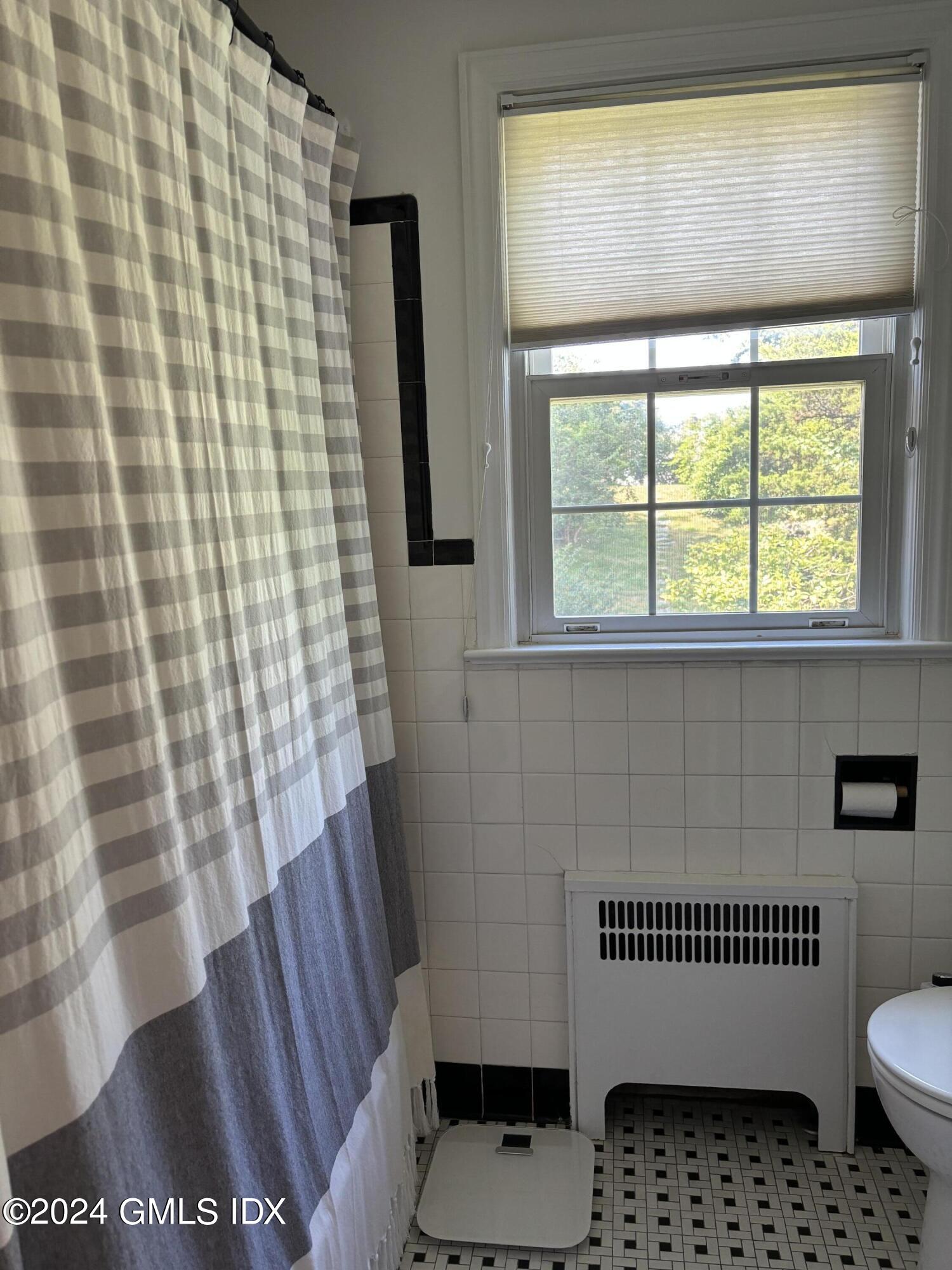 7 River Lane Cos Cob, CT 06807 - Photo 18 of 30 a bathroom with a sink and a toilet