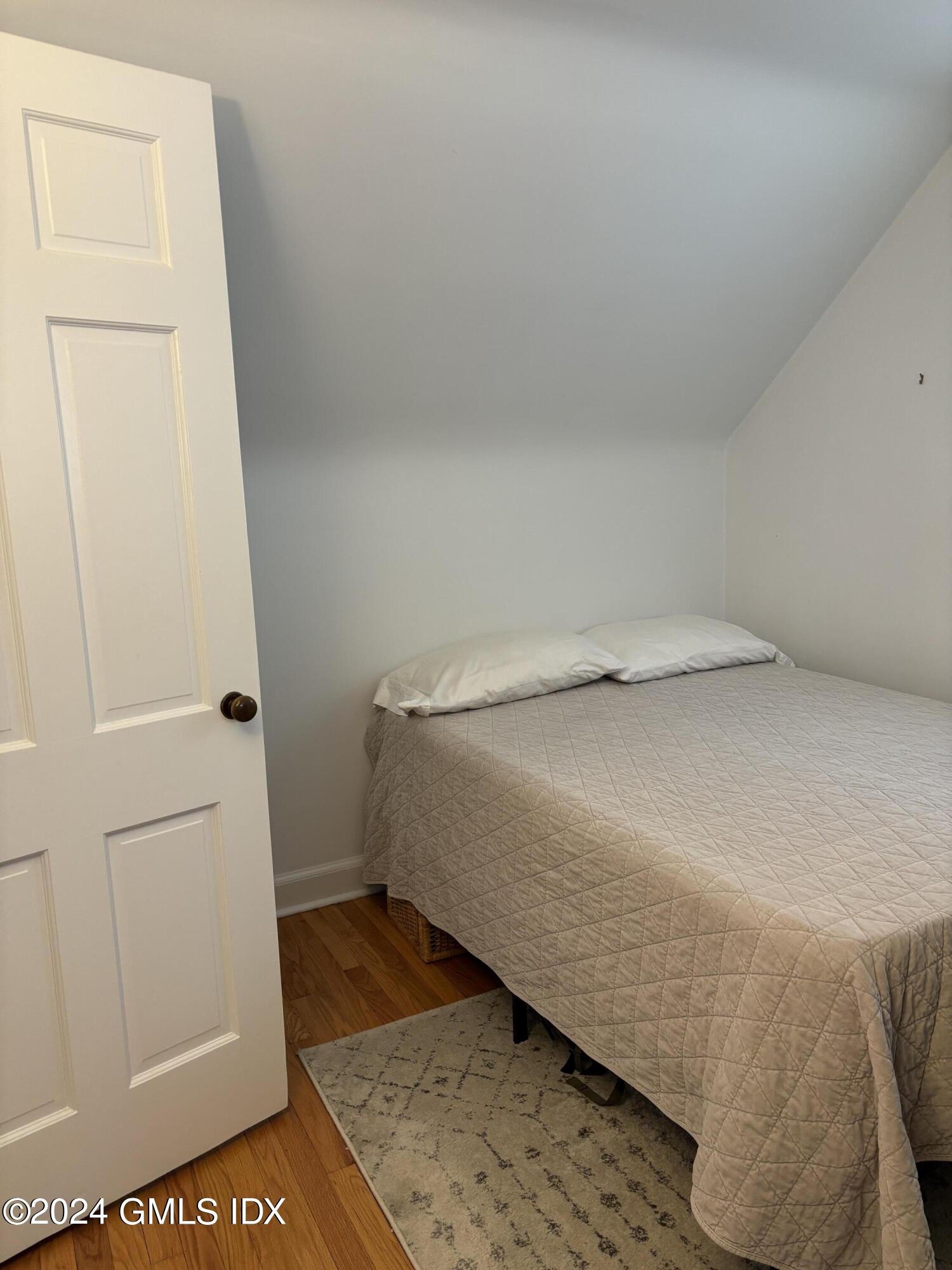 7 River Lane Cos Cob, CT 06807 - Photo 19 of 30 a bed room with a bed and a rug