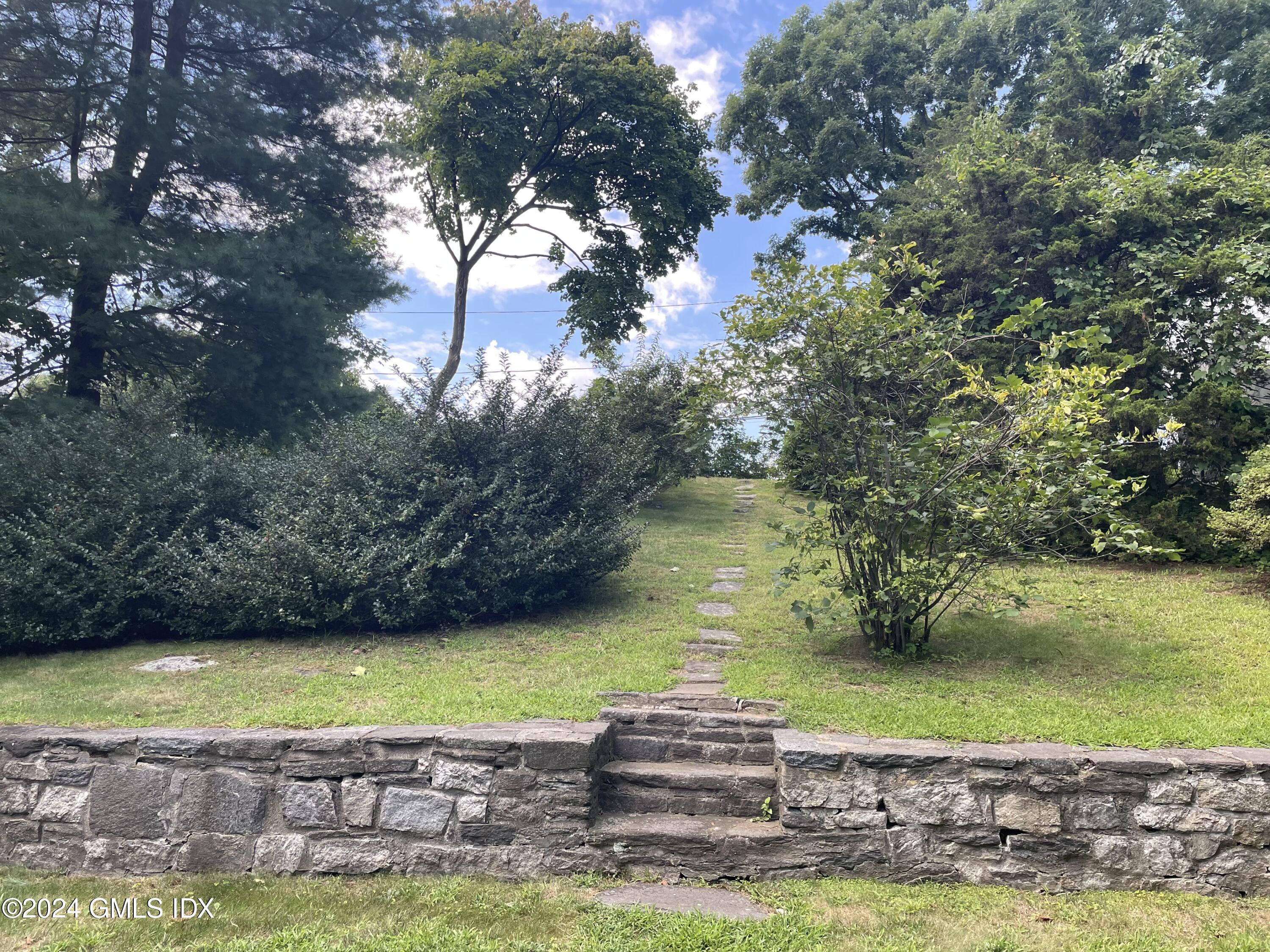 7 River Lane Cos Cob, CT 06807 - Photo 20 of 30 a view of a lake with a yard
