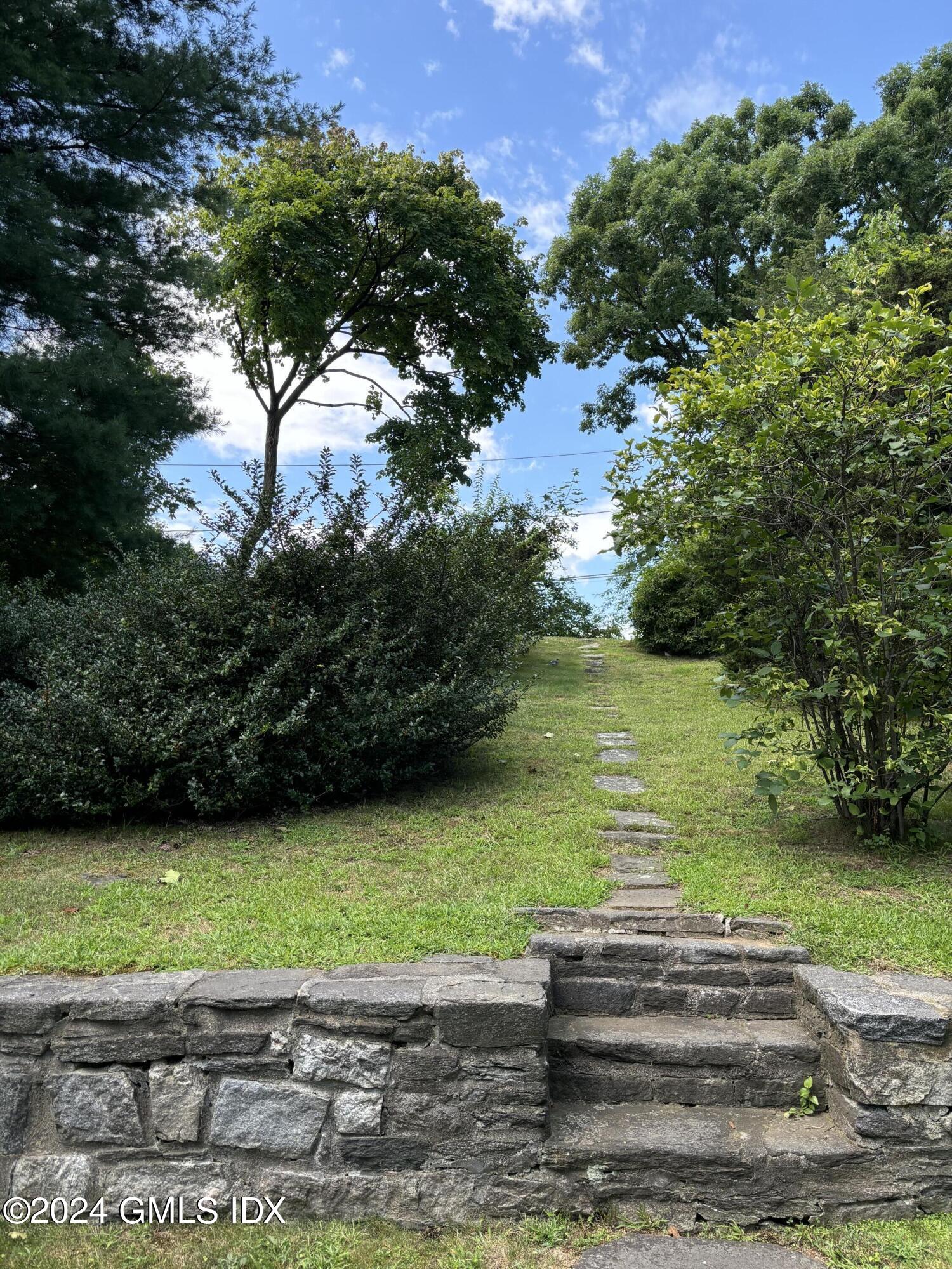 7 River Lane Cos Cob, CT 06807 - Photo 21 of 30 a view of a water with large trees