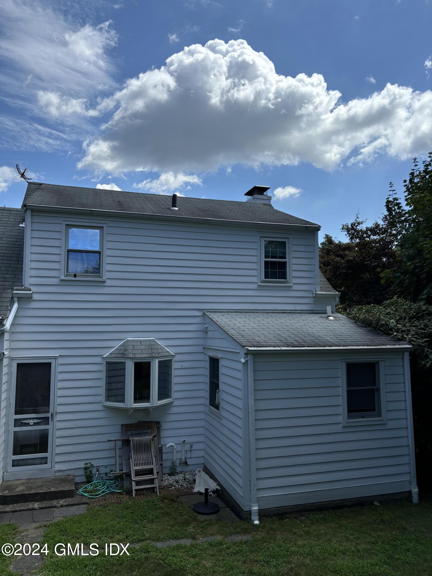 7 River Lane Cos Cob, CT 06807 - Photo 22 of 30 a view of a house with a yard