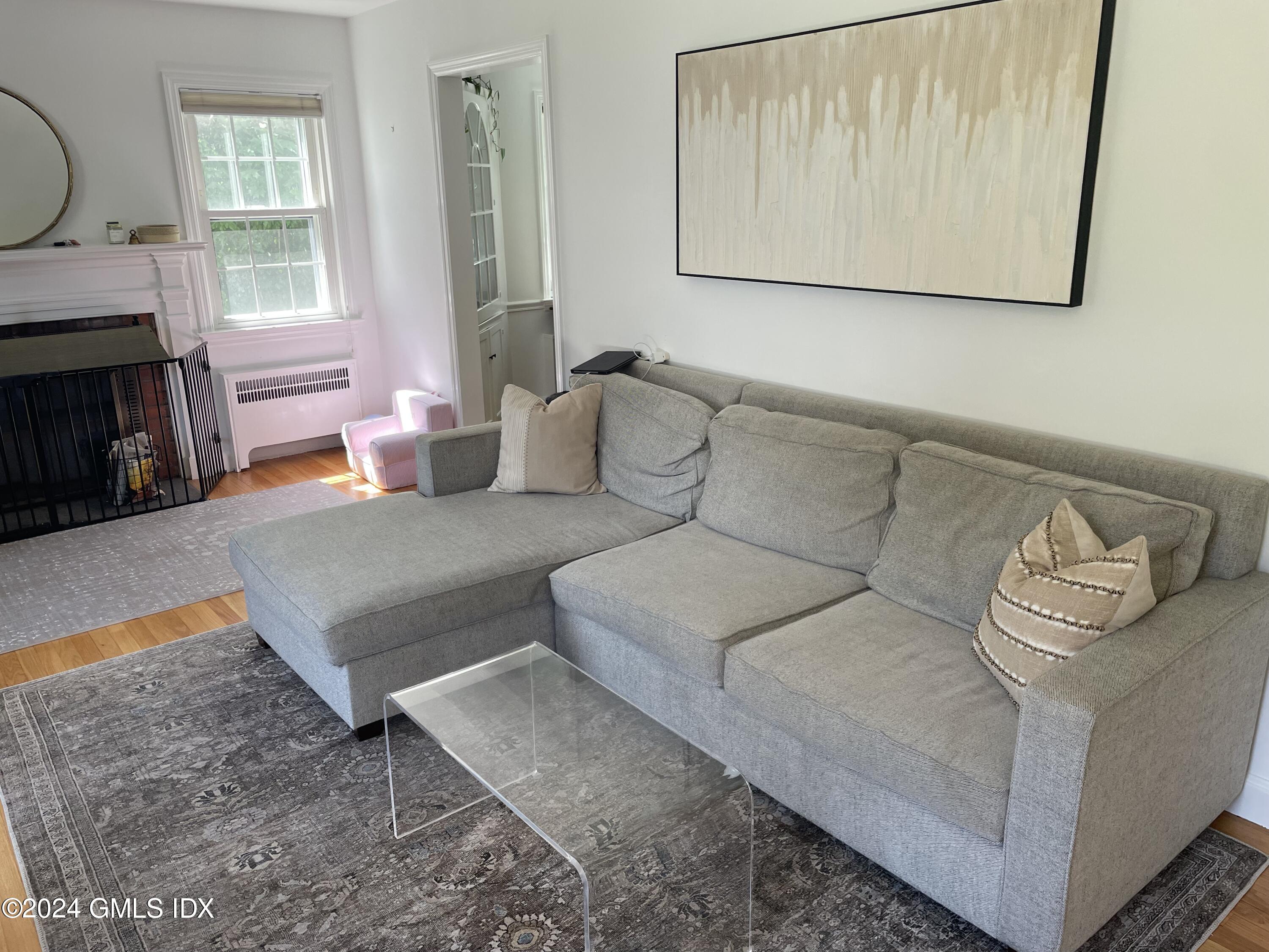 7 River Lane Cos Cob, CT 06807 - Photo 5 of 30 a living room with furniture and a fireplace