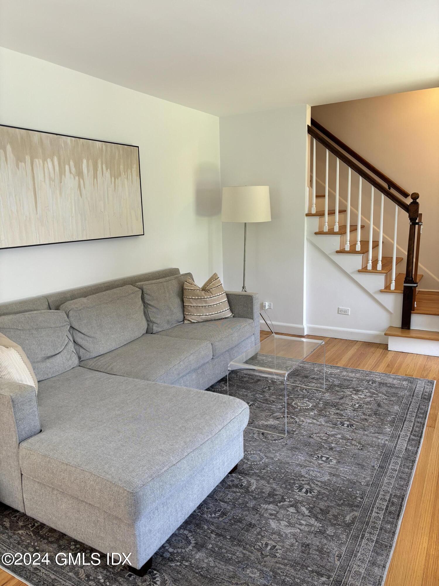 7 River Lane Cos Cob, CT 06807 - Photo 6 of 30 a living room with a couch and a coffee table
