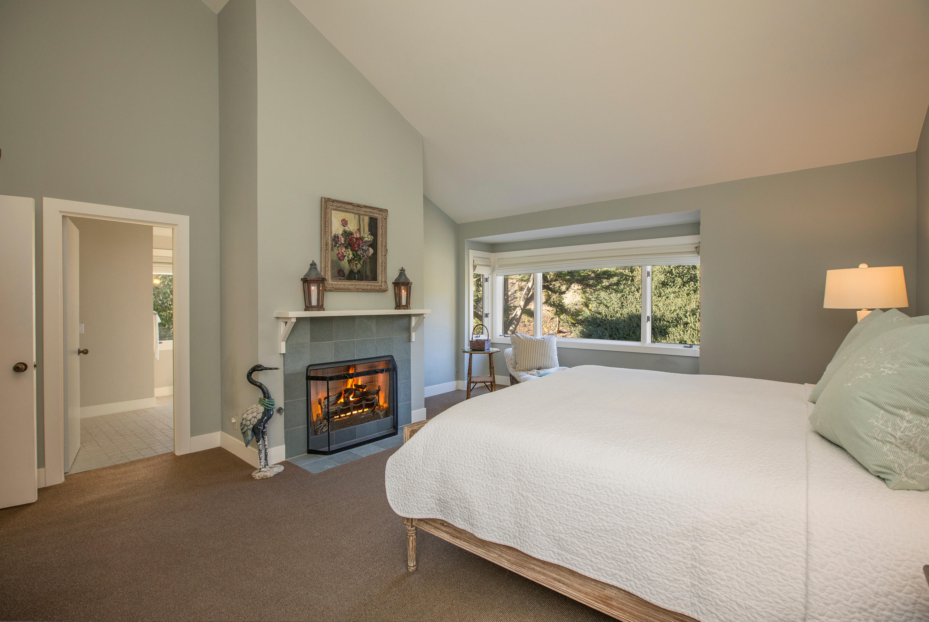 2 Rincon Point Lane Carpinteria, CA 93013 - Photo 12 of 31 a bedroom with a bed and a fireplace