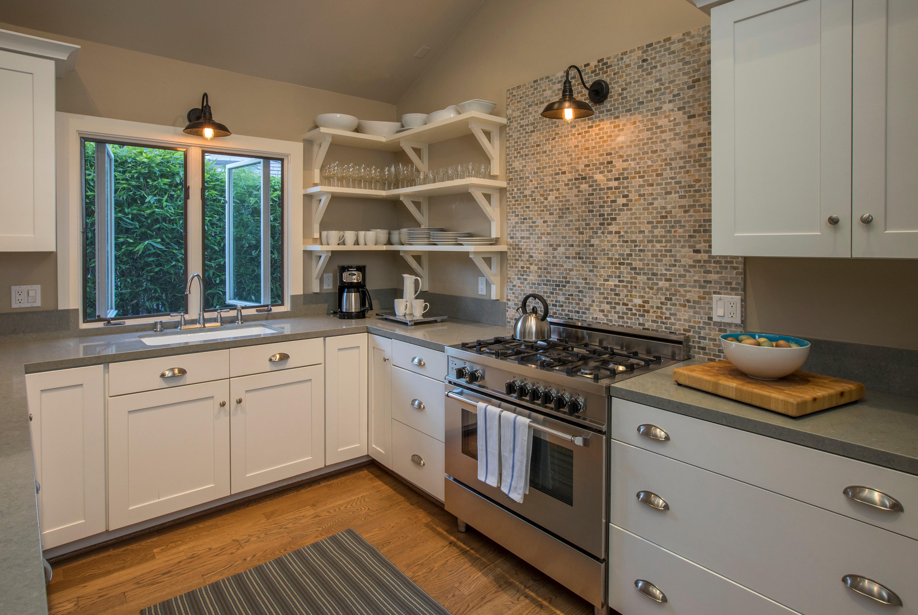 2 Rincon Point Lane Carpinteria, CA 93013 - Photo 6 of 31 a kitchen with stainless steel appliances white cabinets and a stove