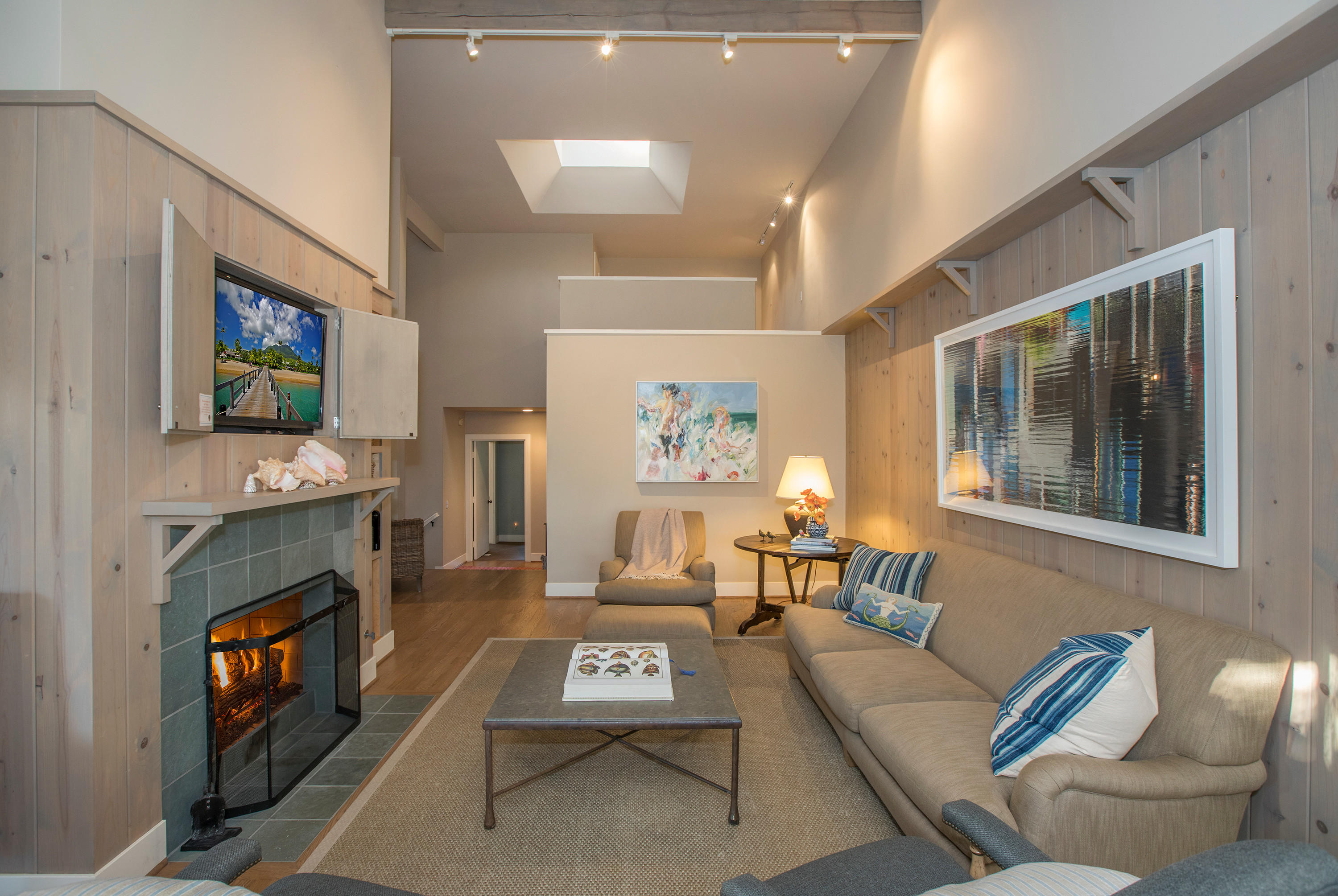 2 Rincon Point Lane Carpinteria, CA 93013 - Photo 9 of 31 a living room with furniture a flat screen tv and a fireplace