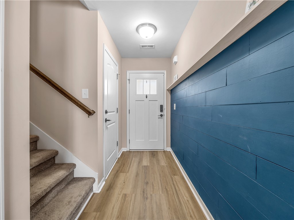 2520 Linmar Circle Anderson, SC 29621 - Photo 8 of 50 A welcoming entryway with durable flooring, stylish shiplap accent wall, and convenient access to the staircase.